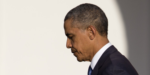 President Barack Obama walks from the stage after speaking during a memorial service for the victims of the Washington Navy Yard shooting at Marine Barracks Washington, Sunday, Sept. 22, 2013, in Washington. A gunman killed 12 people in the Navy Yard on Monday, Sept. 16, 2013, before being fatally shot in a gun battle with law enforcement. (AP Photo/Carolyn Kaster)