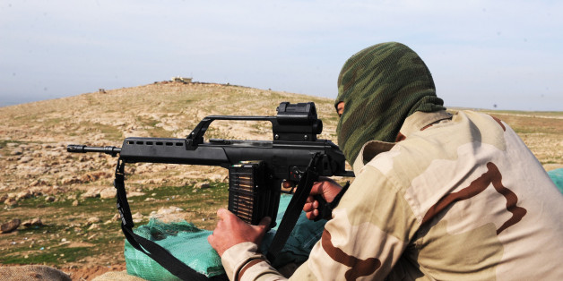 MOSUL, IRAQ - DECEMBER 09: A member of Peshmerga, the armed force of the Iraqi Kurdish Regional Government (KRG), is seen behind one of the new heavy weaponry sent by Germany and other western countries to fight against the Islamic State of Iraq and the Levant (ISIL) in the Bashiqa mountains near Mosul, Iraq on December 9, 2014. (Photo by Hamit Huseyin/Anadolu Agency/Getty Images)