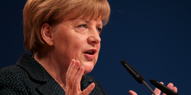 COLOGNE, GERMANY - DECEMBER 10: Germany's Chancellor and head of Christian Democratic Union (CDU) Angela Merkel gives a speech at CDU's closure session of the 27th party congress in Cologne, Germany on December 10, 2014. (Mehmet Kaman - Anadolu Agency)