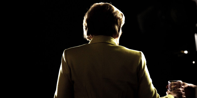 COLOGNE, GERMANY - DECEMBER 10: German Chancellor and Chairwoman of the German Christian Democrats (CDU) Angela Merkel takes a glas of water before she speaks to journalists after the end of the annual CDU party congress on December 9, 2014 in Cologne, Germany. The CDU is the senior partner in Germany's ruling government coalition. (Photo by Carsten Koall/Getty Images)