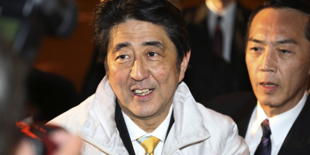 FILE - In this Dec. 13, 2014 photo, Japan's Prime Minister Shinzo Abe smiles during an election campaign for his ruling Liberal Democratic Party in Tokyo a day before Parliament's lower house election. Japanese Prime Minister Abeâs ruling party is headed for a landslide victory in lower house elections, according to projections released soon after polls closed Sunday, Dec. 14, 2014. (AP Photo/Koji Sasahara, File)