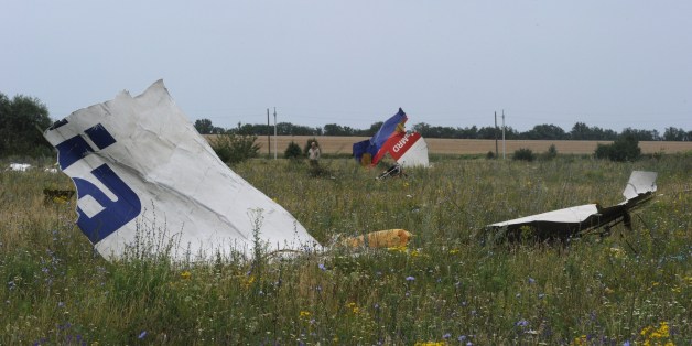 Pieces of wreckage of the Malaysia Airlines flight MH17 are pictured on July 18, 2014 in Shaktarsk, the day after it crashed. Flight MH17 from Amsterdam to Kuala Lumpur, which US officials believe was hit by a surface-to-air missile over Ukraine, killing all 298 people on board. AFP PHOTO / DOMINIQUE FAGET (Photo credit should read DOMINIQUE FAGET/AFP/Getty Images)