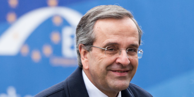 Greece's Prime Minister Antonis Samaras arrives for a meeting of EPP members ahead of an EU summit in Brussels on Thursday, Dec. 18, 2014. European Union leaders meet with the top agenda item an ambitious plan to use EU seed money and loan guarantees to jumpstart investment and revive the EU's growth and job creation rates. (AP Photo/Geert Vanden Wijngaert)