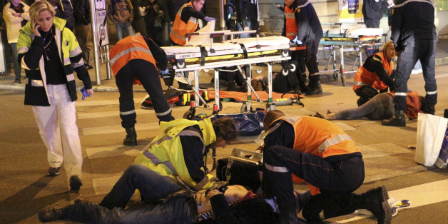 This photo provided Monday, Dec. 22, 2014 by local newspaper Le Bien Public shows rescue workers tending at victims after a driver deliberately slammed into passersby in several spots in Dijon, central France, Sunday Dec. 21, 2014. French police are raising security after an attack on officers in central France, and the countryâs top security official is arriving in the city where a driver ran down 11 pedestrians. (AP Photo/Christian Guileminot; Le Bien Public)