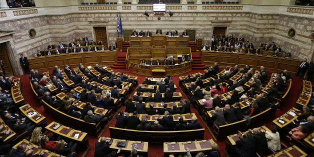 Greek lawmakers attend the third round of voting to elect a new Greek president at the Parliament in Athens on Monday, Dec. 29, 2014, as Greece heads to early general elections after parliament failed to elect a new president in a third and final round of voting. The coalition governmentâs candidate for the post, the 73-year-old former European commissioner Stavros Dimas, garnered 168 votes from parliamentâs 300 seats, short of the 180 votes needed to win. (AP Photo/Thanassis Stavrakis)