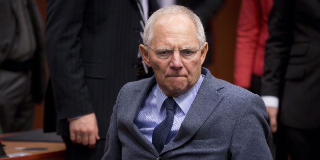 German Finance Minister Wolfgang Schaeuble arrives for a meeting of the eurogroup finance ministers at the EU Council building in Brussels on Monday, Dec. 8, 2014. (AP Photo/Virginia Mayo)