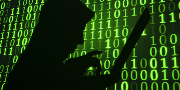 Computer hacker silhouette. Green binary code background