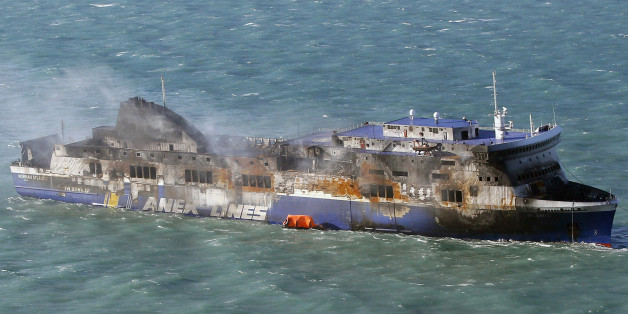 Smoke billows from the Italian-flagged Norman Atlantic ferry that caught fire in the Adriatic Sea, Tuesday, Dec. 30, 2014. A blaze broke out on the car deck of the Norman Atlantic Sunday, Dec. 28, while the ferry was traveling from the Greek port of Patras to Ancona in Italy causing the death of at least 11 people. Italian and Greek helicopter rescue crews evacuated 427 people among passengers and crew members but Italian officials think the death toll could be much higher because of serious dis