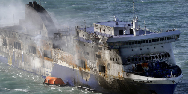 Smoke billows from the Italian-flagged Norman Atlantic ferry that caught fire in the Adriatic Sea, Tuesday, Dec. 30, 2014. A blaze broke out on the car deck of the Norman Atlantic Sunday, Dec. 28, while the ferry was traveling from the Greek port of Patras to Ancona in Italy causing the death of at least 11 people. Italian and Greek helicopter rescue crews evacuated 427 people among passengers and crew members but Italian officials think the death toll could be much higher because of serious discrepancies in the ship's manifest and confusion over how many people were aboard. "We cannot say how many people may be missing," Italian Transport Minister Maurizio Lupi said at a news conference. The cause of the fire is under investigation. (AP Photo/Antonio Calanni)