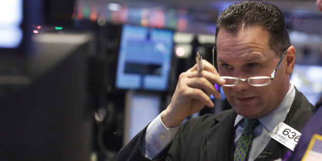 Trader Edward Curran works on the floor of the New York Stock Exchange Monday, Jan. 5, 2015. US stocks opened lower Monday, led by declines in energy stocks as the price of oil plunged again. (AP Photo/Richard Drew)