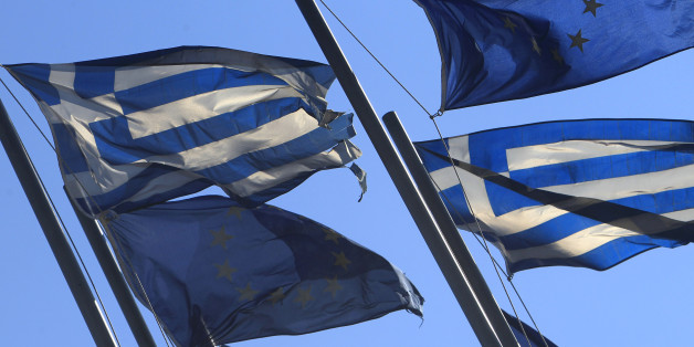 EU and Greek flags fly at the entrance of Thessaloniki's International Exhibition Center, Greece, on Tuesday, Jan. 8, 2013. Greece has entered a sixth year of economic recession, and faces record high unemployment and homelessness rates as it struggles to tackle an acute financial crisis that has forced drastic cuts in state spending. (AP Photo/Nikolas Giakoumidis)