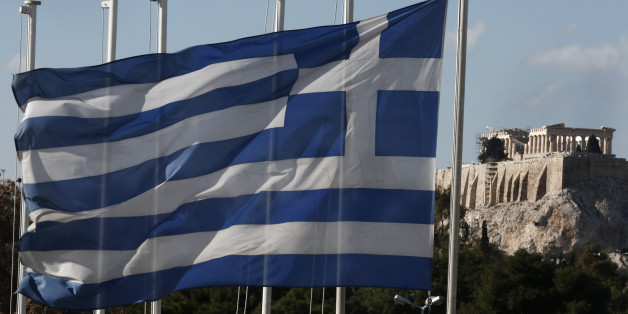 A Greek flag flies in front of the ancient Parthenon temple atop the Acropolis hill, in Athens, on Wednesday, Jan. 7, 2015. Following months of speculation, the eurozone is seeing a fall in consumer prices, a development that's likely to reinforce expectations that the European Central Bank will soon provide an aggressive monetary stimulus, tempered by worries about the plunge in oil prices and renewed doubts about Greece's membership of the euro currency bloc. (AP Photo/Petros Giannakouris)