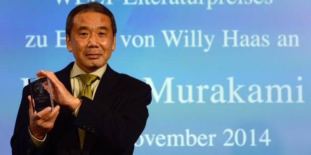 Japanese writer Haruki Murakami poses with his trophy prior to an award ceremony for the Germany's Welt Literature Prize bestowed by the German daily Die Welt, in Berlin on November 7, 2014. AFP PHOTO / JOHN MACDOUGALL (Photo credit should read JOHN MACDOUGALL/AFP/Getty Images)