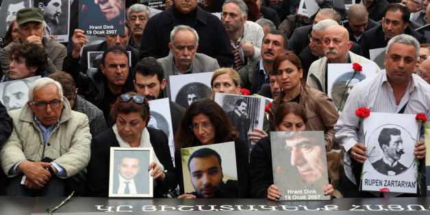 Turkish and Armenian activists gather to protest the killings of Armenians during the last century in Turkey, in Istanbul, Turkey, Thursday, April 24, 2014, a day after Prime Minister Recep Tayyip Erdogan has issued a conciliatory message to Armenians on the eve of the anniversary of the massacre of Armenians almost a century ago, calling the events of World War I "our shared pain." In a statement released Wednesday in nine languages - including Armenian - Erdogan said he hoped Armenians who lo