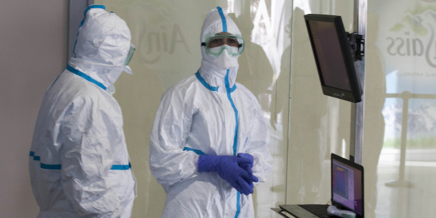 CASABLANCA, MOROCCO - JANUARY 12 : Employees of the airport medical service wait to proceed a test to screen passengers for the Ebola virus at Mohammed V International Airport in Casablanca, Morocco on January 12, 2015. (Photo by Jalal Morchidi/Anadolu Agency/Getty Images)