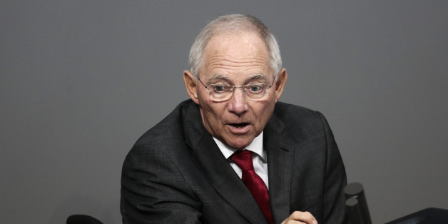 Finance Minister Wolfgang Schaeuble delivers his speech during the final four days debate of a debt free national budget for 2015 at the parliament Bundestag in Berlin, Tuesday, Nov. 25, 2014. (AP Photo/Markus Schreiber)