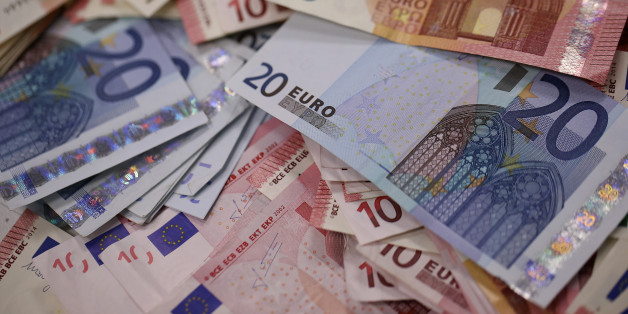 Multiple denomination euro banknotes are arranged for a photograph inside a Travelex store, operated by Travelex Holdings Ltd., in London, U.K., on Monday, Jan. 12, 2015. The euro approached a nine-year low against the dollar as European Central Bank officials fueled speculation the institution will start a program of government-bond buying as early as next week to stave off deflation. Photographer: Simon Dawson/Bloomberg via Getty Images
