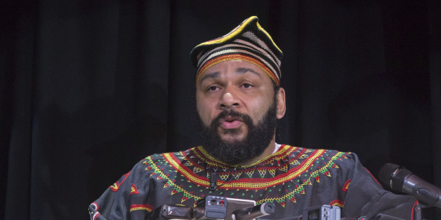 French comic Dieudonne M'Bala M'Bala speaks to the media during a press conference in a theater in Paris, Saturday, Jan. 11, 2014. Dieudonne has been repeatedly convicted of inciting racial hatred or anti-Semitism and has agreed to abandon a controversial show that has been banned in multiple cities. After a Paris show Saturday was banned by authorities, he told a news conference that he will no longer do the âLe Murâ show and replacing it with a new performance. (AP Photo/Michel Euler