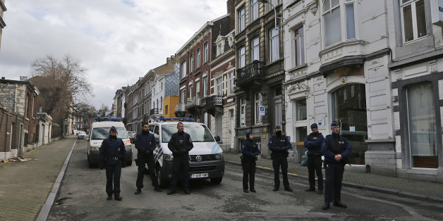 Belgian police officers guard a street in Verviers, Belgium, Friday, Jan. 16, 2015. Police blocks a street after security forces took part in anti-terrorist raids in Verviers, eastern Belgium. Belgian authorities say two people have been killed and one has been arrested during a shootout in an anti-terrorist operation in the eastern city of Verviers. (AP Photo/Frank Augstein)
