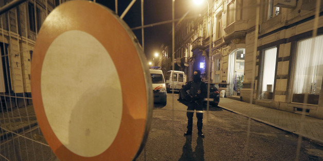 A Belgian police officer guards a street in Verviers, Belgium, Friday, Jan. 16, 2015. Belgian authorities say two people have been killed and one has been arrested during a shootout in an anti-terrorist operation in Verviers. (AP Photo/Frank Augstein)