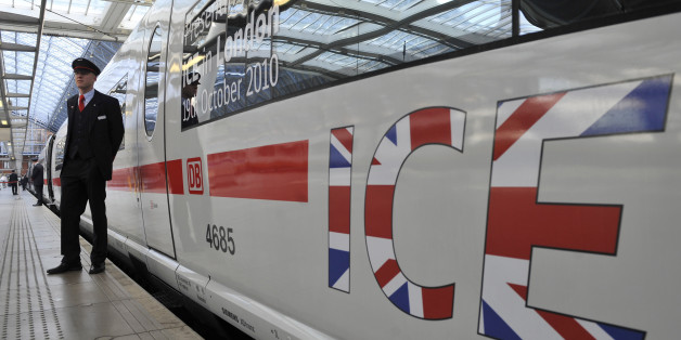 A member of Deutsche Bahn staff stands next to a German Intercity Express (ICE) high speed train at St. Pancras International Train Station in London, Tuesday, Oct. 19, 2010. Safety tests of a high-speed German train went well over the weekend and showed that a full train could be evacuated in less than 20 minutes, Eurotunnel said Tuesday. Deutsche Bahn is hoping to begin service through the tunnel in 2012 or 2013. However, its ICE 3 trains do not conform to current safety rules for passenger trains operating in the Channel Tunnel. (AP Photo/Lennart Preiss)