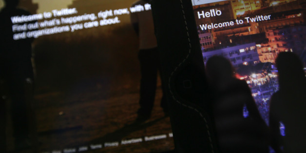 In this Wednesday, July 31, 2013 photo-illustration, the home page for Twitter is displayed on an iPad and a laptop computer. If Twitter is the chirping chatterbox of the Internet, trolls are its dark underground denizens. The collision of the two is driving a debate in Britain about the scale of hatred and the limits of free speech online.The furor erupted this week after several women went public about the sexually explicit and often luridly violent abuse they receive on Twitter from trolls _ online bullies and provocateurs who send abusive or disruptive messages, often for their own amusement. Many regard trolls as an annoyance to be ignored, but there are growing calls for action when their abuse crosses over into threats. (AP Photo/Alastair Grant)