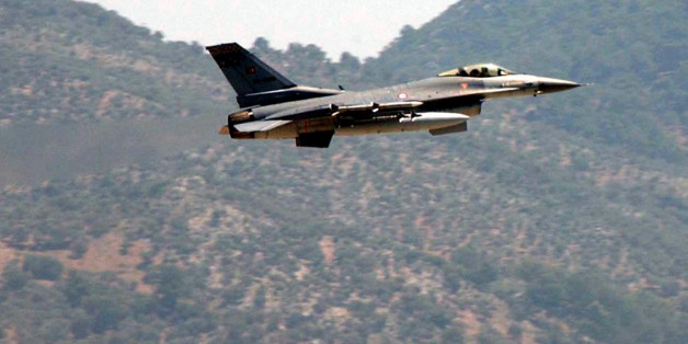 A Turkish Air Force F-16 fighter jet flies over a military airbase in Dalaman near the southwestern Turkish city of Mugla, Tuesday, May 23, 2006. A Greek and a Turkish warplane collided Tuesday over the Aegean Sea island of Karpathos as they shadowed each other. The Turkish pilot was rescued by a merchant ship, while a Greek helicopter and navy vessels searched for the Greek pilot after the two F-16 jets crashed into the sea 20 kilometers, 12.5 miles, south of Karpathos. (AP Photo/Anatolia, Kenan Gurbuz) ** TURKEY OUT **