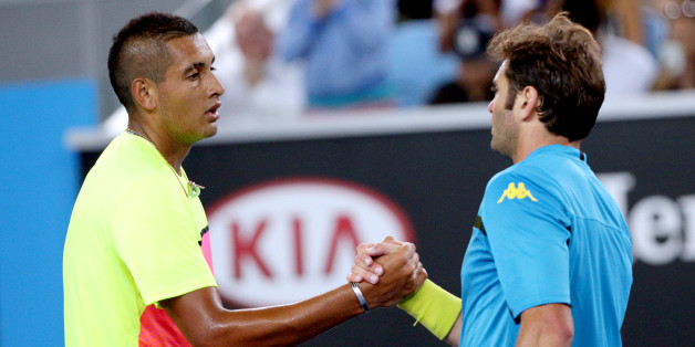 Nick Kyrgios of Australia, left, is congratulated by Malek Jaziri of Tunisia after winning their third round match at the Australian Open tennis championship in Melbourne, Australia, Friday, Jan. 23, 2015. (AP Photo/Rob Griffith)