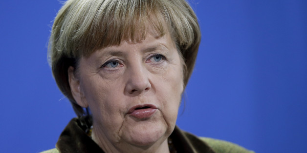 German Chancellor Angela Merkel addresses the media during a joint press conference as part of a meeting with the President of Azerbaijan Ilham Aliyev, at the chancellery in Berlin, Germany, Wednesday, Jan. 21, 2015. (AP Photo/Michael Sohn)
