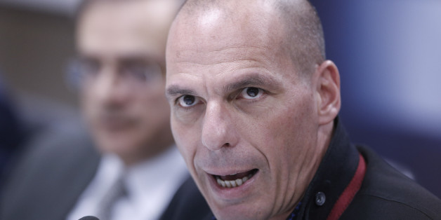 Greece's new Finance Minister Yanis Varoufakis makes statements during a handover ceremony at the Finance Ministry in Athens, Wednesday, Jan. 28, 2015. Greece's radical new government on Wednesday signaled the country would backtrack or scrap a series of budget measures its eurozone creditor nations had demanded in exchange for bailout loans. (AP Photo/Petros Giannakouris)