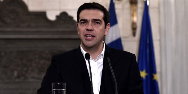 Greek Prime Minister Alexis Tsipras speaks during a press conference with the European Parliament president after their meeting in Athens on January 29, 2015. Greece will seek 'common ground' with its European peers on solving its bailout and debt woes, European Parliament chairman Martin Schulz said on January 29 after meeting new Prime Minister Alexis Tsipras. AFP PHOTO / ARIS MESSINIS (Photo credit should read ARIS MESSINIS/AFP/Getty Images)