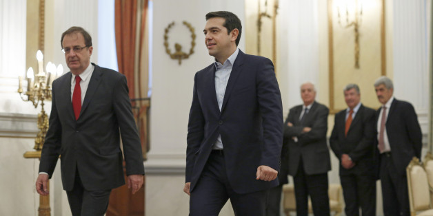 Alexis Tsipras, Greek Prime Minister-elect, center, arrives at the presidential palace to be sworn in as prime minister in Athens, Greece, on Monday, Jan. 26, 2015. The Independent Greeks party will support Syriza in a vote of confidence in Parliament slated for Feb. 5, Independent Greeks Party Leader Panos Kammenos told reporters after meeting with Tsipras. Photographer: Kostas Tsironis/Blooomberg