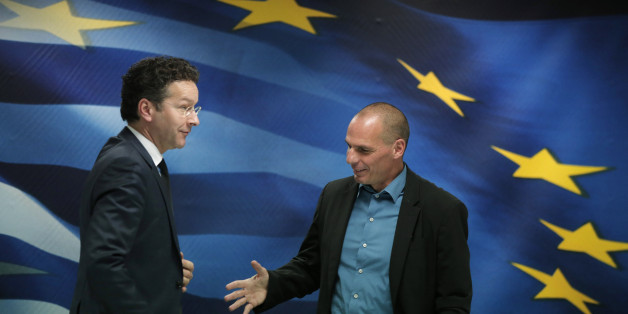 Greece's Finance Minister Yanis Varoufakis, right, reaches out to shake hands with Dutch Finance Minister and Eurogroup President Jeroen Dijsselbloem, left, following a joint news conference after their meeting at the Finance Ministry in Athens, Friday, Jan. 30, 2015. Dijsselbloem who chairs eurozone finance meetings says there is no decision so far on what to do after Greeceâs current bailout program runs out at the end of next month. (AP Photo/Lefteris Pitarakis)