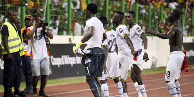 Ghana soccer players celebrate after their African Cup of Nations quarter final soccer match with Guinea at the Estadio De Malabo, Equatorial Guinea, Sunday, Feb. 1, 2015. (AP Photo/Sunday Alamba)