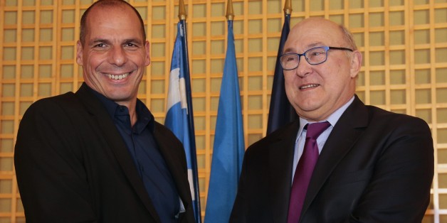 Greek Finance Minister Yanis Varoufakis (L) shakes hands with his French counterpart Michel Sapin after a press conference following their meeting at the French Finance Ministry in Paris on February 1, 2015. Varoufakis is on a two-days visit to Paris to launch the Greek new anti-austerity government's search for EU allies. AFP PHOTO / JACQUES DEMARTHON (Photo credit should read JACQUES DEMARTHON/AFP/Getty Images)