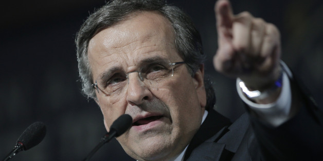 Greece's Prime Minister Antonis Samaras delivers his final campaign speech at the Taekwondo Indoor Stadium in southern Athens on Friday, Jan. 23, 2015. All opinion polls on Sunday's closely-watched national election agree: The radical left opposition Syriza party, which has vowed to rewrite the terms of Greece's international bailout, enjoys a lead of at least 4 percentage points over Prime Minister Antonis Samaras' conservatives. (AP Photo/Lefteris Pitarakis)