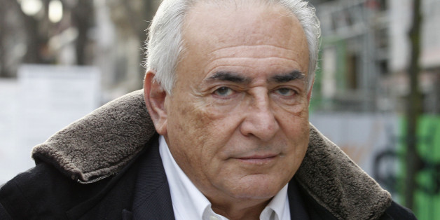 FILE - In this Dec. 11, 2012 file photo, former International Monetary Fund chief Dominique Strauss-Kahn leaves his apartment building in Paris. French judges decided Wednesday, Dec.19, 2012 not to drop aggravated pimping charges against Strauss-Kahn. His lawyer says he will appeal. (AP Photo/Jacques Brinon, File)