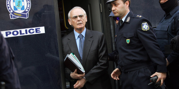 Greek former defence minister, Akis Tsohatzopoulos, arrives for a court trial in Athens on April 22, 2013. The trial of a prominent Greek 73-year-old socialist ex-minister, accused of money laundering over controversial arms deals, opened in a criminal court in Athens early today. Facing a sentence of up to 20 years, Tsochatzopoulos is accused of pocketing kickbacks on state contracts to buy a Russian-made anti-missile system and German submarines during his stint as defence minister. AFP PHOTO/