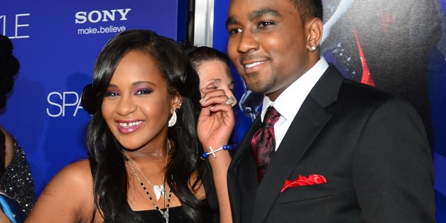 The late Whitney Houston's daughter Bobbi Kristina (L) and date arrive for the world premiere of the film 'Sparkle' at Grauman's Chinese Theater in Hollywood,California on August 16, 2012. The film opens across the US on August 17. AFP PHOTO / Frederic J. BROWN (Photo credit should read FREDERIC J. BROWN/AFP/GettyImages)