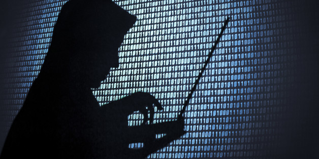 Computer hacker silhouette. Blue binary code background. Seattle office.