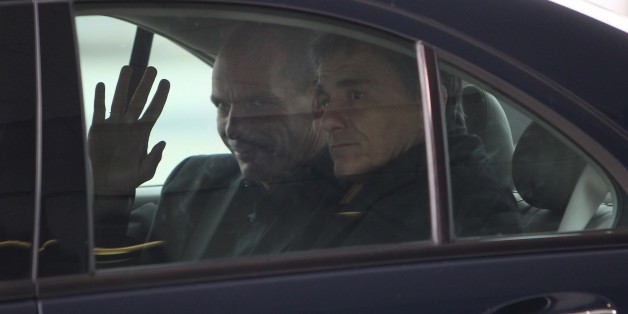 Greek Finance Minister Yanis Varoufakis (L) leaves the European Central Bank (ECB) in Frankfurt am Main, western Germany, on February 4, 2015. Varoufakis seeks to build support for a renegotiation of his country's 240 billion euro ($270 billion) bailout. AFP PHOTO / DANIEL ROLAND (Photo credit should read DANIEL ROLAND/AFP/Getty Images)