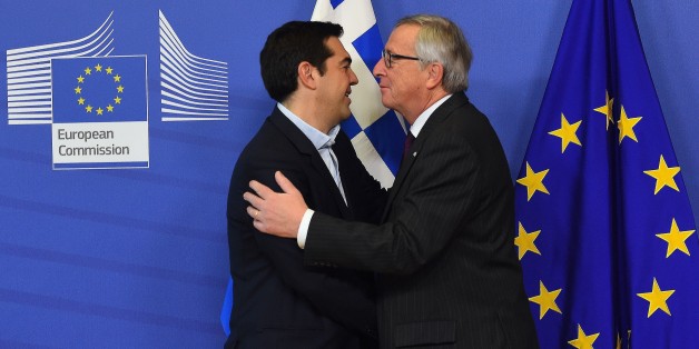 European Commission President Jean-Claude Juncker (R) greets Greek Prime Minister Alexis Tsipras at the European Commission headquarters in Brussels on February 4, 2015. Greek Prime Minister Alexis Tsipras made his first visit to Brussels since coming to power, promising to renegotiate his country's international bailout. AFP PHOTO / EMMANUEL DUNAND (Photo credit should read EMMANUEL DUNAND/AFP/Getty Images)