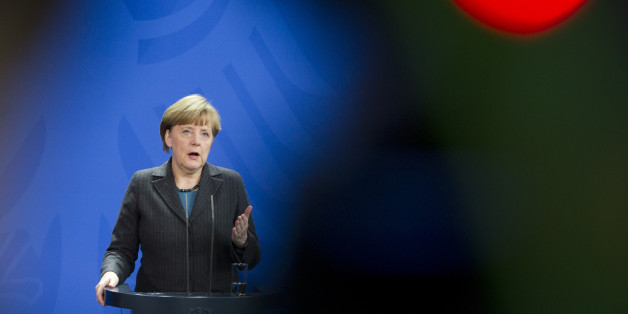 German Chancellor Angela Merkel addresses the media during a joint press conference as part of a meeting with Prime Minister of Singapore Lee Hsien Loong at the chancellery in Berlin, Germany, Tuesday, Feb. 3, 2015. (AP Photo/Steffi Loos)