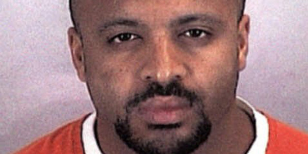 FILE - In this undated file photo provided by the Sherburne County Sheriff Office, Zacarias Moussaoui is shown. Moussaoui, known as the "20th hijacker" in the 9/11 terror attacks is asking a South Florida federal judge for a transfer to the military prison at Guantanamo Bay, Cuba. The request is part of a rambling, handwritten letter filed Wednesday, Dec. 10, 2014, in Miami federal court. He is serving a life prison sentence after pleading guilty in 2005 to conspiring with the Sept. 11 hijackers to kill Americans. Moussaoui has been writing letters to courts around the country from his prison cell in Florence, Colorado, claiming inside knowledge about al-Qaida and the Sept. 11, 2001, plot. The letter filed in Miami repeats some of those claims. (AP Photo/Sherburne County, Minn., Sheriff's Office, File)