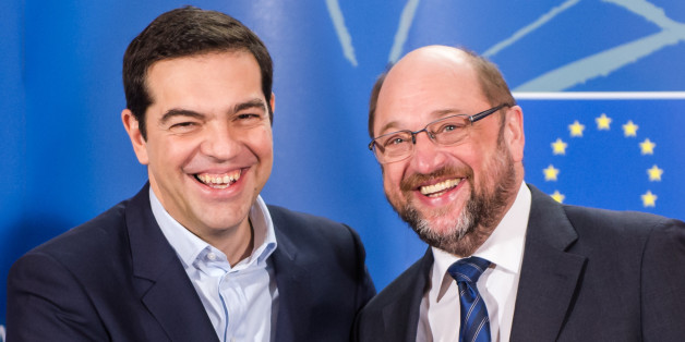 European Parliament President Martin Schulz, right, welcomes Greece's Prime Minister Alexis Tsipras upon his arrival at the European Parliament in Brussels on Wednesday, Feb. 4, 2015. Tsipras is on a one day trip to Brussels to meet with EU leaders.(AP Photo/Geert Vanden Wijngaert)