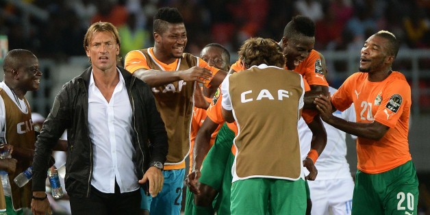 Ivory Coast's players and coach Herve Renard celebrate after scoring a third goal during the 2015 African Cup of Nations semi-final football match between Democratic Republic of the Congo and Ivory Coast in Bata on February 4, 2015. AFP PHOTO / KHALED DESOUKI (Photo credit should read KHALED DESOUKI/AFP/Getty Images)