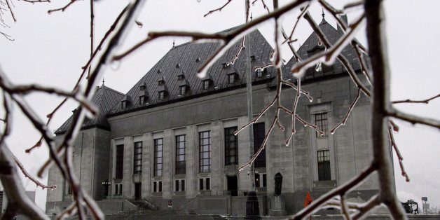 Ice coats tree branches outside of the Supreme Court of Canada in Ottawa on Dec.10, 2012. A divided Supreme Court of Canada has raised the bar for Ottawa and the provinces in their dealings with public sector employees by affirming the right to strike as constitutionally protected.