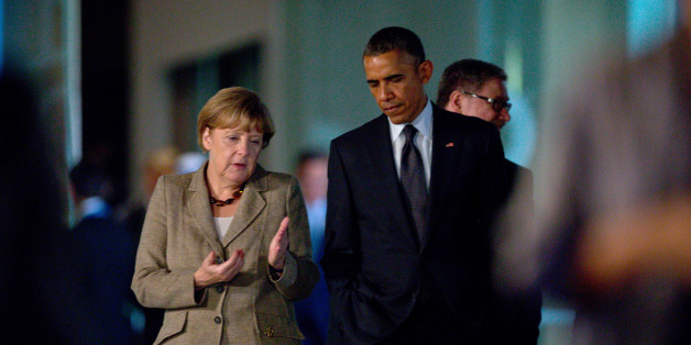 BRISBANE, AUSTRALIA - NOVEMBER 15: In this handout photo provided by the G20 Australia, Germany's Chancellor Angela Merkel walks with US President Obama from Queensland State Library to the Gallery of Modern Art on November 15, 2014 in Brisbane, Australia. World leaders have gathered in Brisbane for the annual G20 Summit and are expected to discuss economic growth, free trade and climate change as well as pressing issues including the situation in Ukraine and the Ebola crisis. (Photo by Patrick Hamilton/G20 Australia via Getty Images)