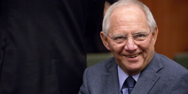 German Finance Minister Wolfgang Schaeuble waits for the start of a meeting of the eurogroup finance ministers at the EU Council building in Brussels on Monday, Dec. 8, 2014. (AP Photo/Virginia Mayo)