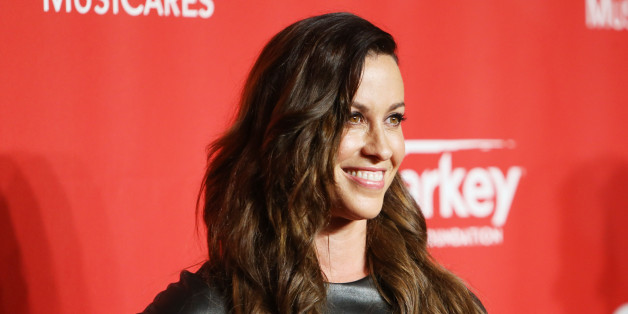 LOS ANGELES, CA - FEBRUARY 06: Alanis Morissette arrives at the 2015 MusiCares Person of The Year honoring Bob Dylan held at Los Angeles Convention Center on February 6, 2015 in Los Angeles, California. (Photo by Michael Tran/FilmMagic)